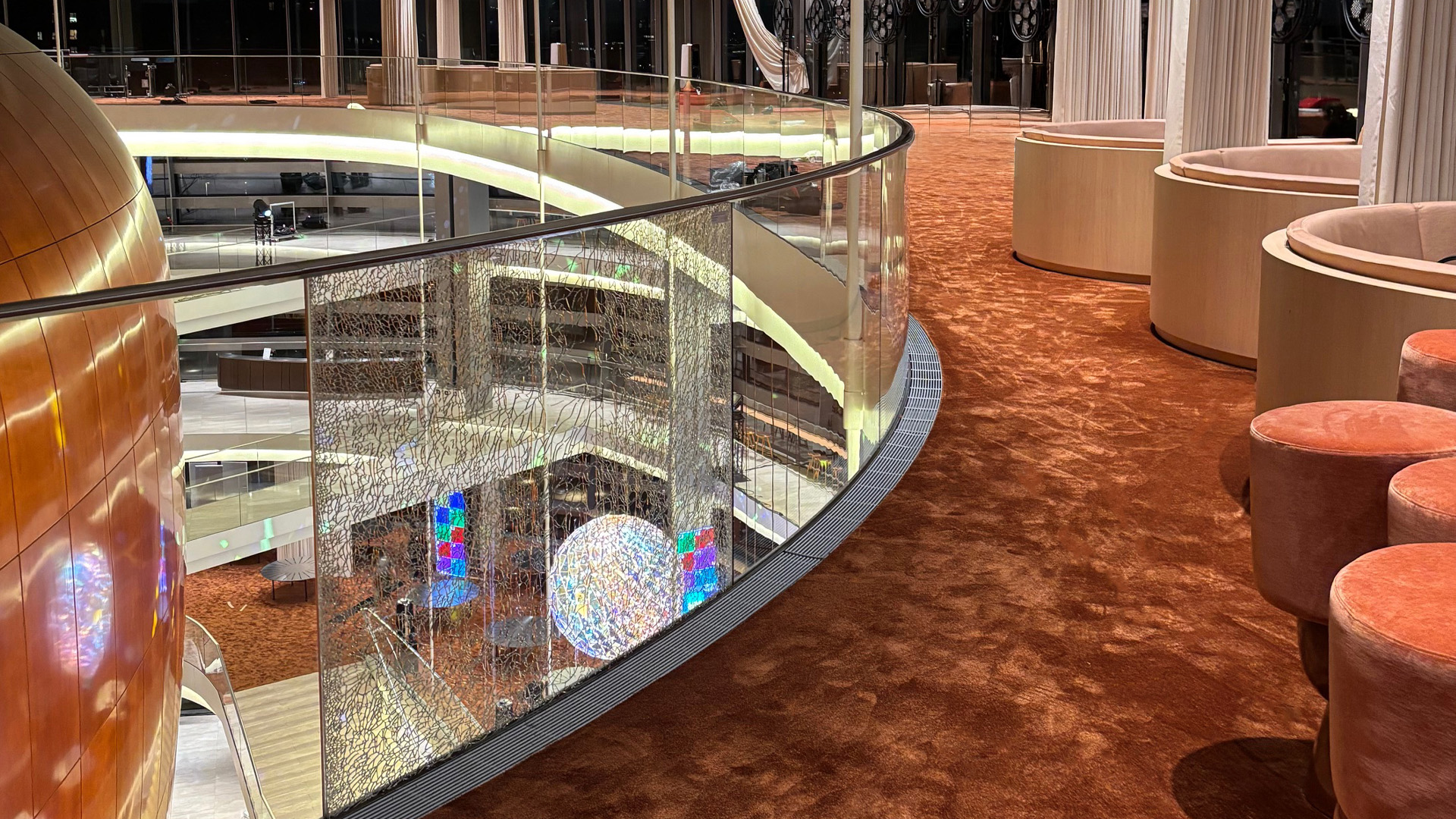 Royal Danish Opera balcony with copper flat-woven carpet and glass balustrade